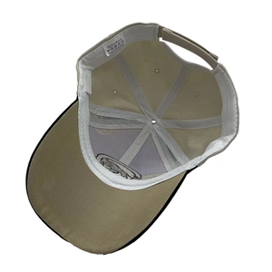 Detailed internal view of khaki baseball cap showing 100% acrylic fabric and stitching