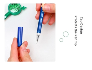 Detail of blue Christmas reindeer pen showing cap removal and snowflake patterns