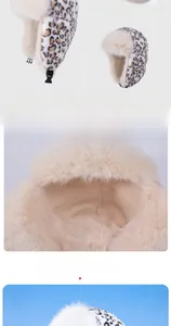 Detail view of plush leopard print trapper hat showing earflaps and buckle fastener