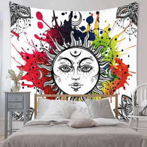 Detail of bohemian sun totem tapestry with colorful splash art over a bedroom wall