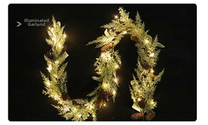 Close-up of a pre-lit Christmas pine garland with warm LED lights and pine cones
