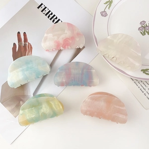 Starry acetate hair claws set in colorful marble and gradient patterns for women