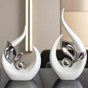 Modern abstract white ceramic decor set with silver leaf accents for luxury home interiors
