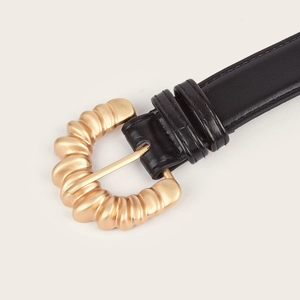 Women's minimalist black leather belt with a textured gold metal buckle for jeans