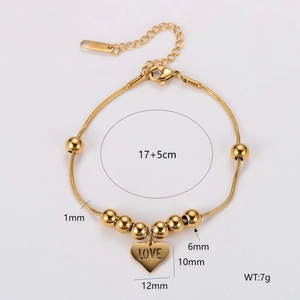 Golden snake chain bracelet with round beads and heart charm engraved with LOVE
