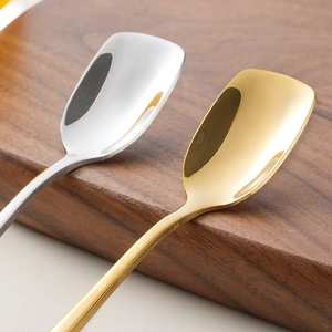 Modern 304 stainless steel square head spoons in gold and silver finish on a wooden board