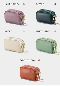 Detailed view of genuine leather coin purses in five colors with triple zippers and keychain
