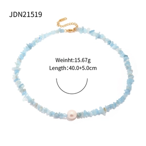 Detail of blue gravel and pearl necklace showing lobster clasp and extension chain