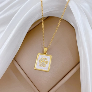 Elegant gold titanium necklace with shell cat paw square pendant and sparkling crystals