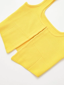 Close-up of yellow ribbed knit tank top featuring U-neck and hidden front hook closures