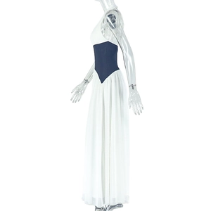 Detail of high waist contrast band and flowing pleated skirt on a halter neck maxi dress