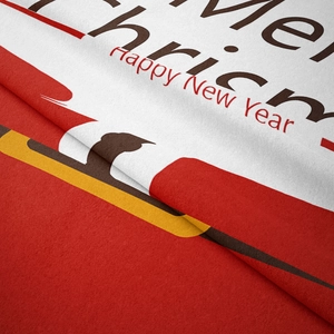 Macro detail showing soft flannel texture with Merry Christmas holiday patterns