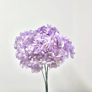 Detailed view of artificial light purple hydrangea bundle with delicate silk flower petals