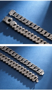 Macro detail of vintage floral carvings on silver-tone stainless steel heavy link bracelet