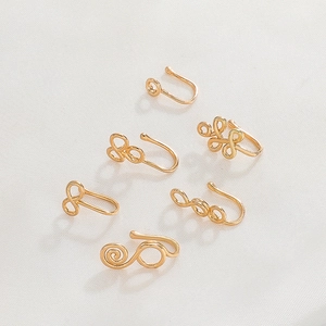 Set of 6 gold U-shaped nose cuffs with creative geometric wire-wrapped designs