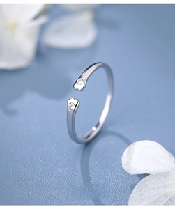 Macro shot of S925 sterling silver cat paw ring with sparkling cubic zirconia stones