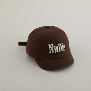 Detail of dark brown cotton baseball cap featuring white 3D NwDie embroidery