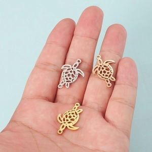 Stainless steel turtle charms in silver, gold, and rose gold finishes for DIY jewelry
