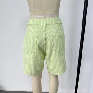 Detail view of the back dual pockets on green and white striped high waist denim shorts