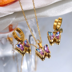 Macro detail of butterfly jewelry set with colorful crystals and golden reflections