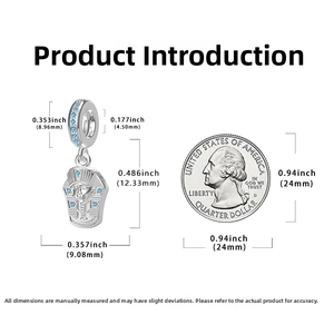 Macro shot of 925 silver Pharaoh charm with blue crystals beside a quarter coin for size
