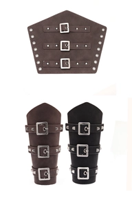 Detail of vintage punk leather arm guards with adjustable metal buckles and rivets