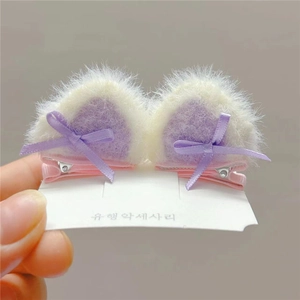 Cute plush cat ear hair clips with purple ribbon bows for girls on a white display card