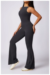 Detail of matte black sleeveless yoga bodysuit featuring flare leggings and slim fit waist