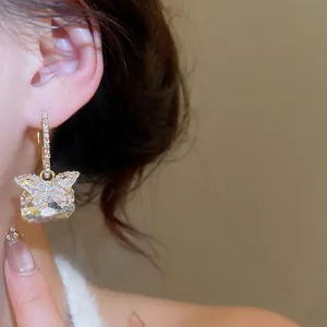 Elegant silver bow earrings with square cubic zirconia and butterfly detail for women