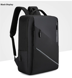 Detail view of the USB charging port on side of black business laptop backpack