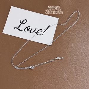 Detail view of 1.35mm silver chain necklace with lobster clasp and adjustable extension