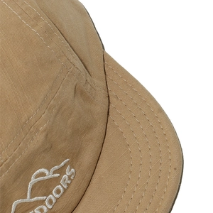 Detail of khaki outdoor cap showing stitching and mountain embroidery on durable fabric