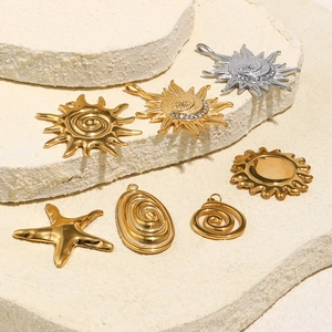 Set of 18K gold and silver celestial charms including sun, moon and seashell pendants