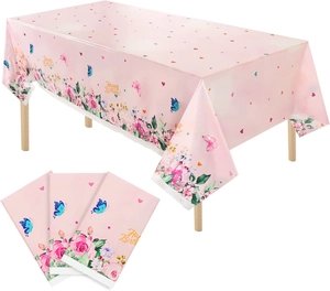 Detail of pink floral butterfly tablecloth and napkins with Happy Birthday text
