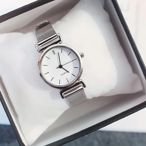 Minimalist silver watch with white dial and metal mesh strap in a black gift box