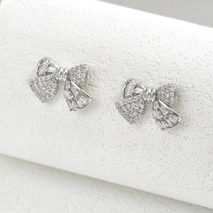 Elegant silver bow stud earrings with sparkling cubic zirconia stones for women