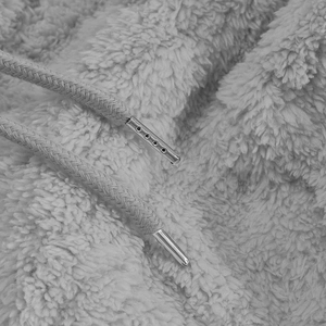 Macro detail of high-quality light grey fleece fabric with premium metal drawstring tips