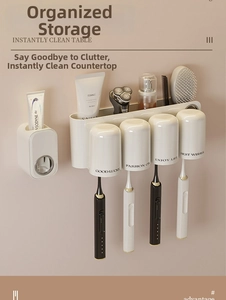 Detail of cream white wall-mounted toothbrush holder set with four magnetic cups