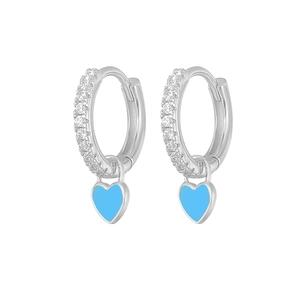 Detail of silver hoop earrings featuring blue enamel hearts and clear cubic zirconia