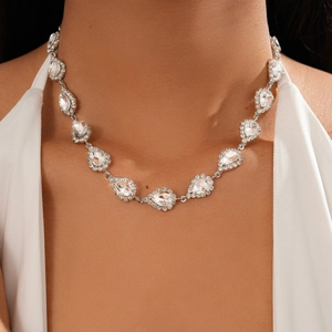 Detailed view of silver teardrop crystal choker necklace worn by a model in luxury style