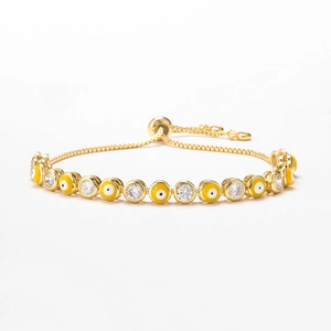 Adjustable evil eye slider bracelet in gold with yellow enamel and micro cubic zirconia