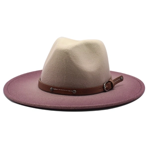 Detail of gradient felt fedora hat featuring a brown leather band and metal buckle accents