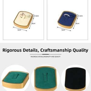 Detail view of 4-slot metal ring display stands with premium velvet lining in multiple colors