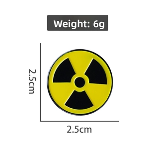 Close-up of radioactive symbol metal pin with 2.5cm diameter and 6g weight specs