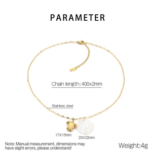 Detail view of 18K gold plated turtle and scallop shell charms on stainless steel chain
