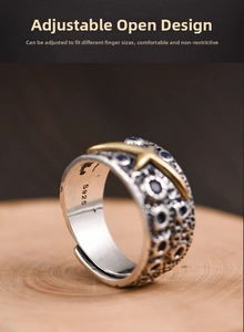 Close-up of S925 silver vintage ring with starry texture and gold star detail