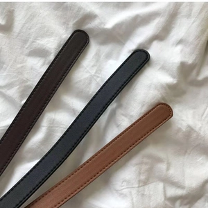 Set of three PU leather belts in brown, black, and tan colors with fine stitching details