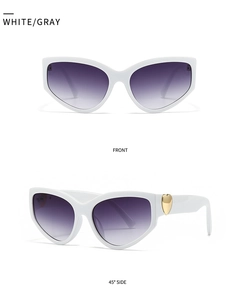 Front and 45 degree side view of white butterfly sunglasses with gold heart detail