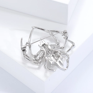Detailed back view of silver spider brooch showing secure pin and safety clasp mechanism