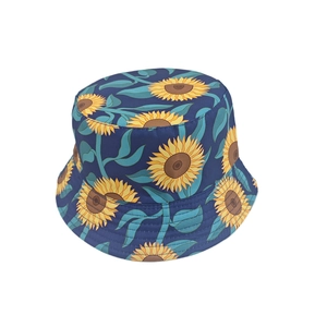 Close-up of a dark blue bucket hat featuring vibrant yellow sunflower print patterns
